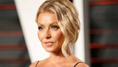 Kelly Ripa, 48, unveils bikini body in skimpy white swimsuit