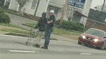 Georgia driver stops to help elderly man cross street