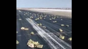 Gold spills on Russian runway after plane door flies open during takeoff