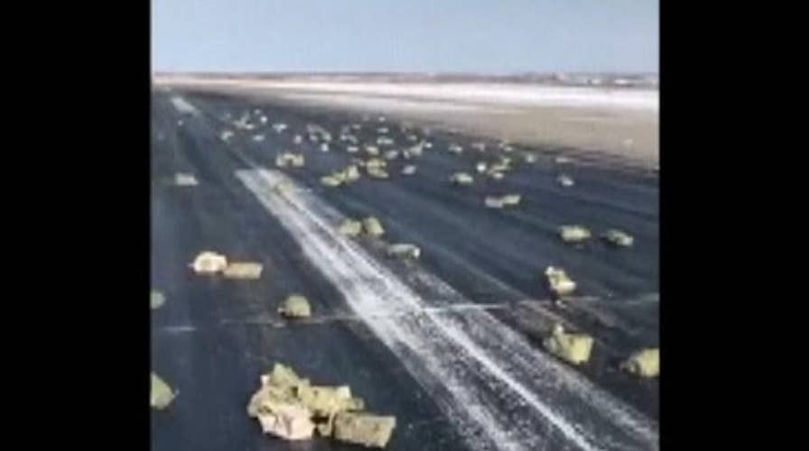 Tons of gold fall from cargo plane onto runway