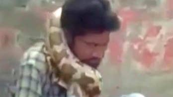Python wraps around snake charmer's neck, nearly strangles him to death as crowd watches in horror