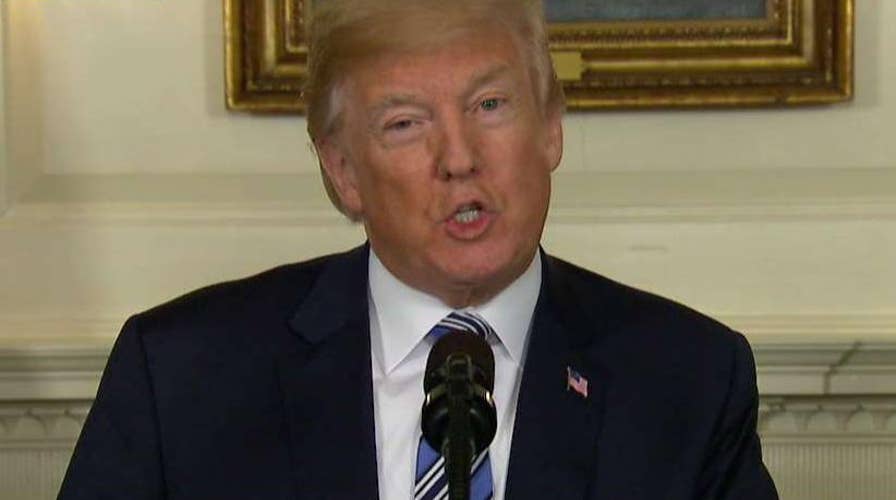 Trump signs spending bill as 'matter of national security'