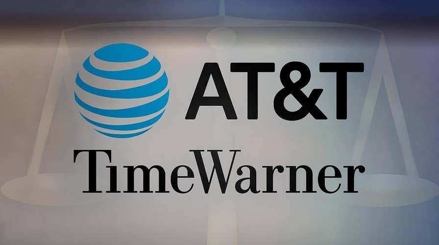 Justice Department squares off against AT&T and Time Warner