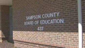 North Carolina boy, 13, suspended after drawing stick figures holding a gun and knives, report says