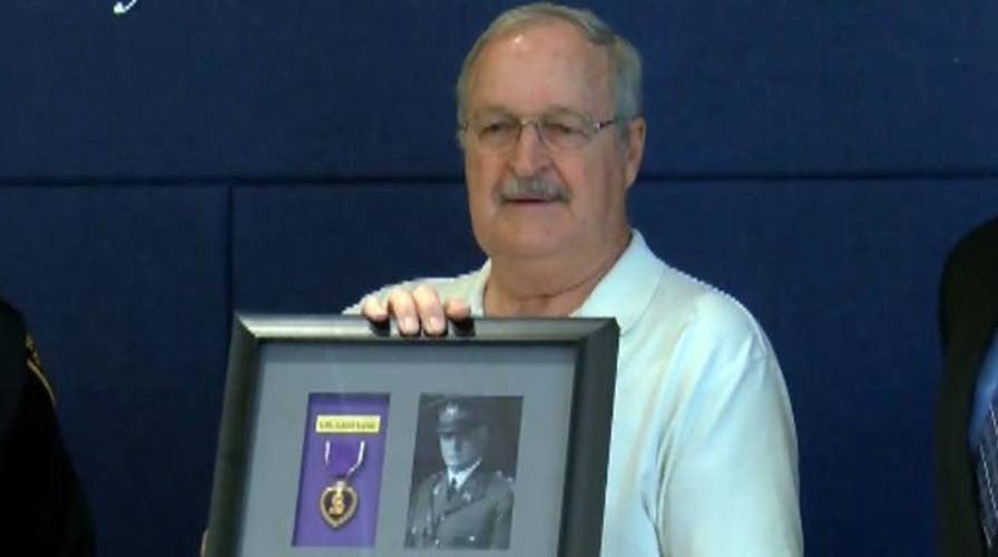 Cop recovers Purple Heart at pawn shop, returns to family