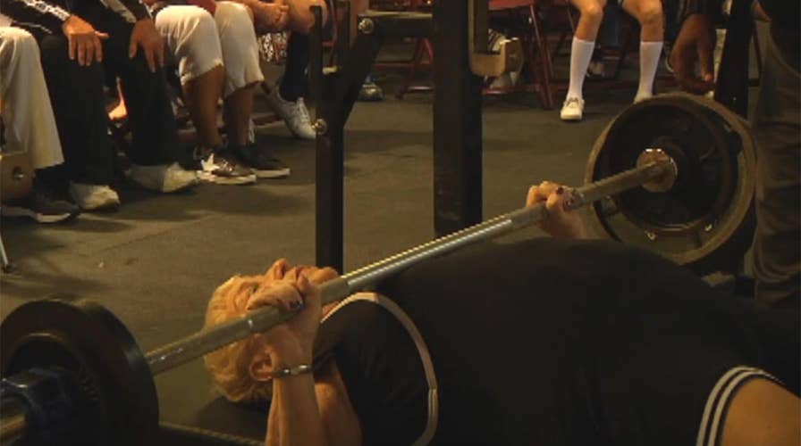 97-year-old flexes muscles at namesake powerlifting event