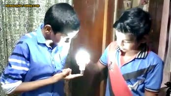 Video shows 9-year-old boy lighting LED bulb with his bare hands