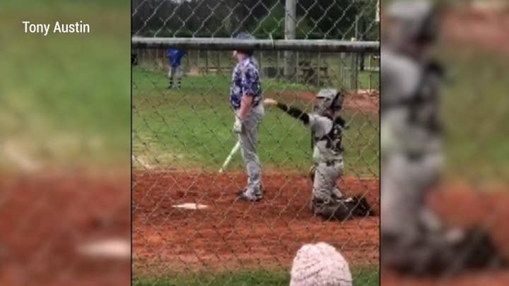 Watch: One-armed high school baseball catcher inspires