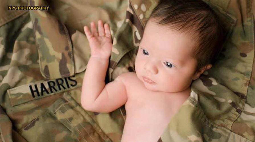 Baby poses in her late father's military uniform