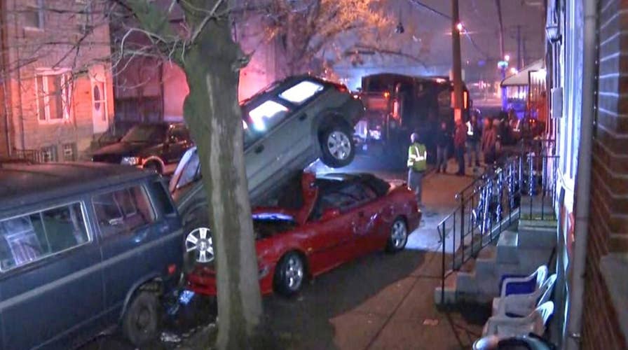 Philadelphia trash truck smashes row of parked cars