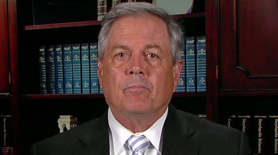 Norman facing backlash for pulling out a gun at a town hall