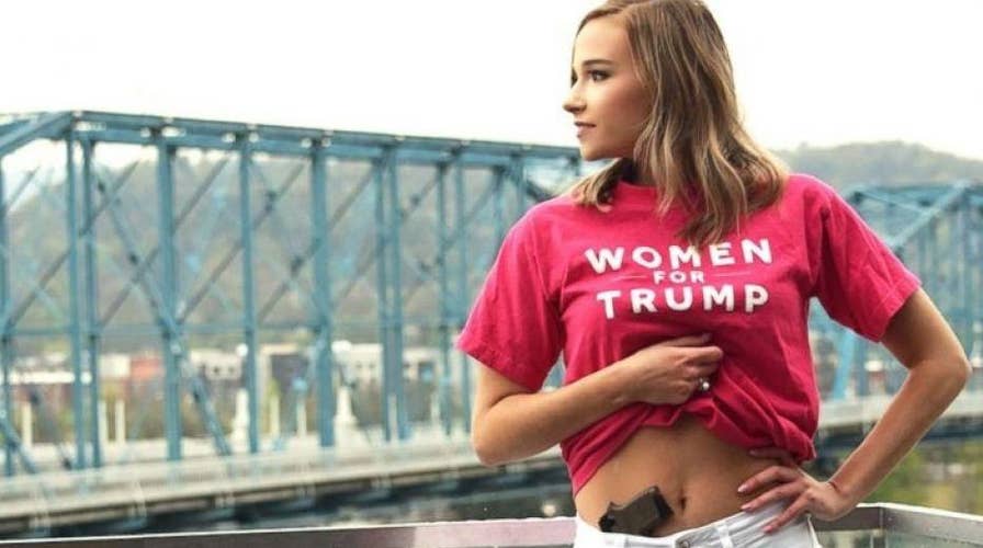College senior poses for graduation picture with a gun in her waistband