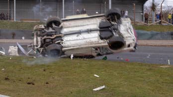 Racing driver survives dramatic 100 mph rollover wreck