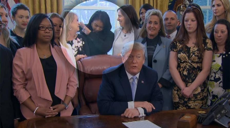 Young woman dabs behind President Trump