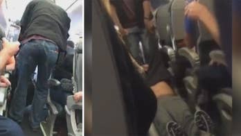 Officer who dragged United passenger from flight suing airline, city of Chicago