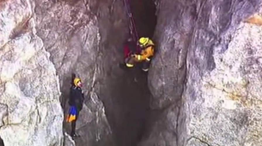 Firefighters rescue man after his car plunges off cliff