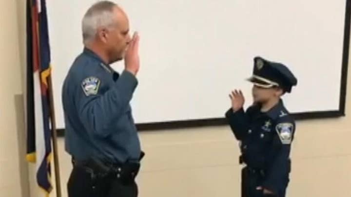 Little boy battling cancer sworn in as police officer
