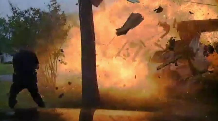 Raw dash cam footage captures house explosion