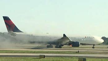 Delta jet makes emergency landing as smoke pours from engine 1 day after Southwest disaster
