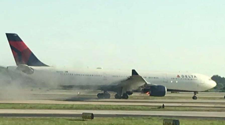 Video shows smoke billowing from Delta plane