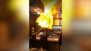 Fiery dish sets off restaurant's sprinklers, almost blasts waiters off their feet