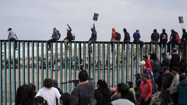 Migrant caravan seeking asylum arrives at US border