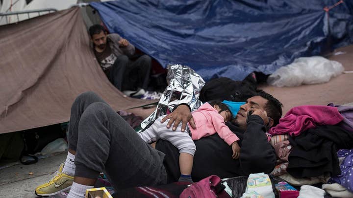 Some members of migrant caravan allowed to apply for asylum
