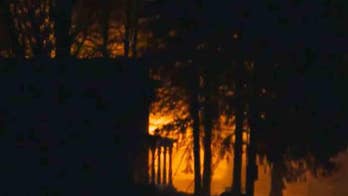 Severely beaten woman escapes from husband before explosion, fire injure 8 cops, reports say