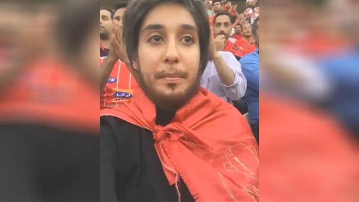 Iranian woman wears fake beard while attending soccer match