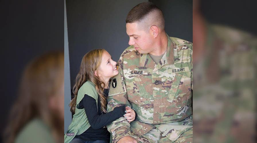 Deployed military unit surprises soldier’s daughter with cheer routine 
