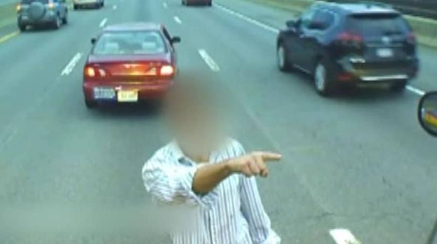 Man parks car on Massachusetts Turnpike, climbs onto bus