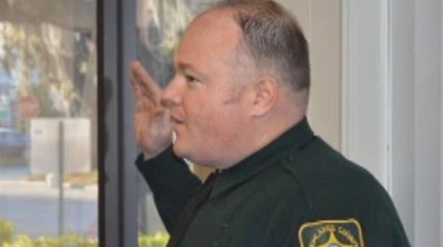 Florida deputy shot, killed responding to dispute over cat