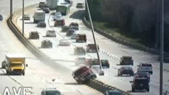 Suspected drunk driver mowed down light poles on busy highway