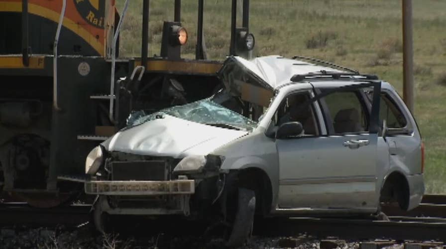 Two people are dead after train hits car