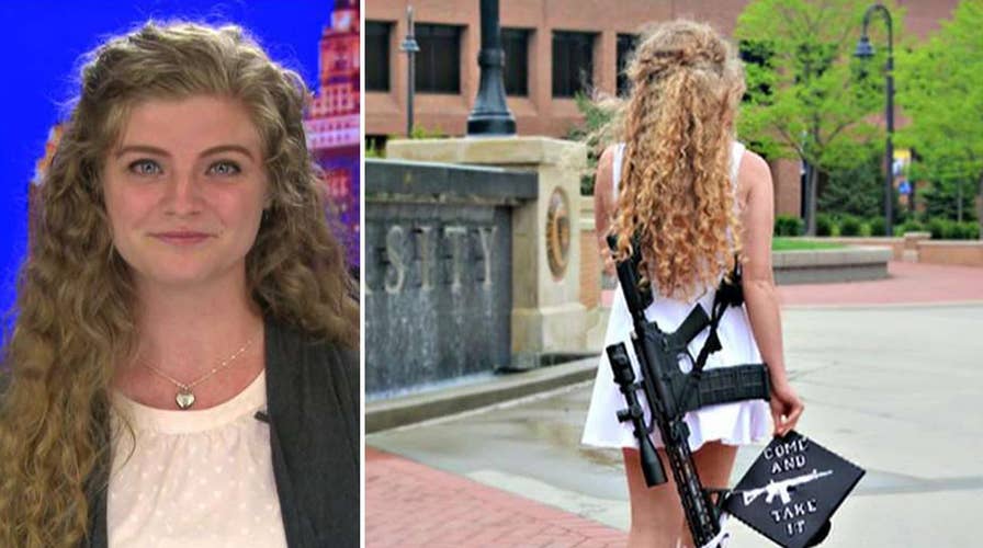 Kent State graduate poses with rifle on campus