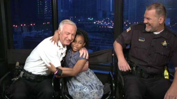 8-year-old travels the US to hug cops