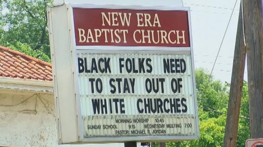 Pastor under fire over controversial sign