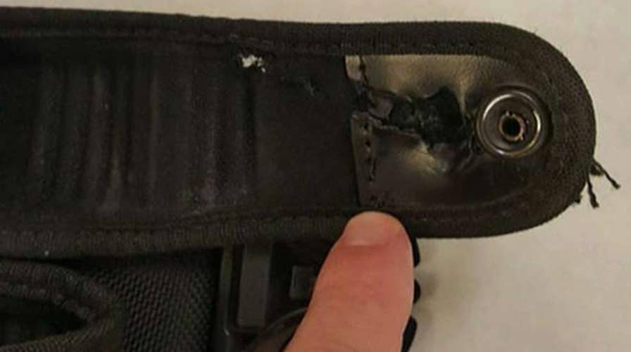 Belt saves officer's life in shootout