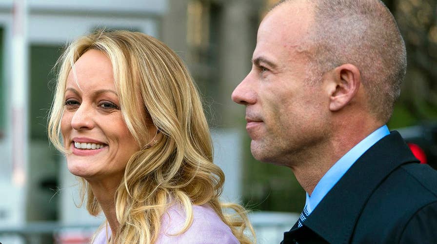 Stormy lawyer threatens press