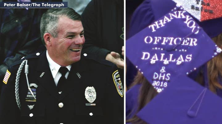 Hero school officer who stopped gunman honored at graduation