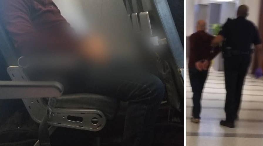 Disorderly Frontier passenger pees on seat in front of him