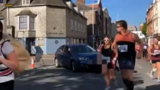Angry woman drives car into path of half marathon - Fox News
