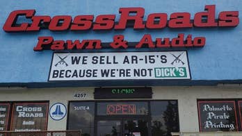 Pawn shop trolls Dick's Sporting Goods with sign advertising AR-15's