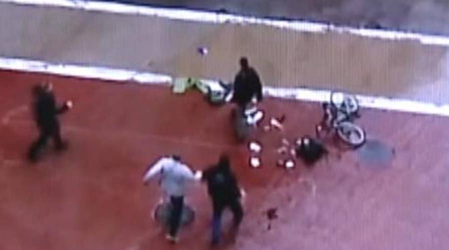 Police tackle man who inspected suspicious package