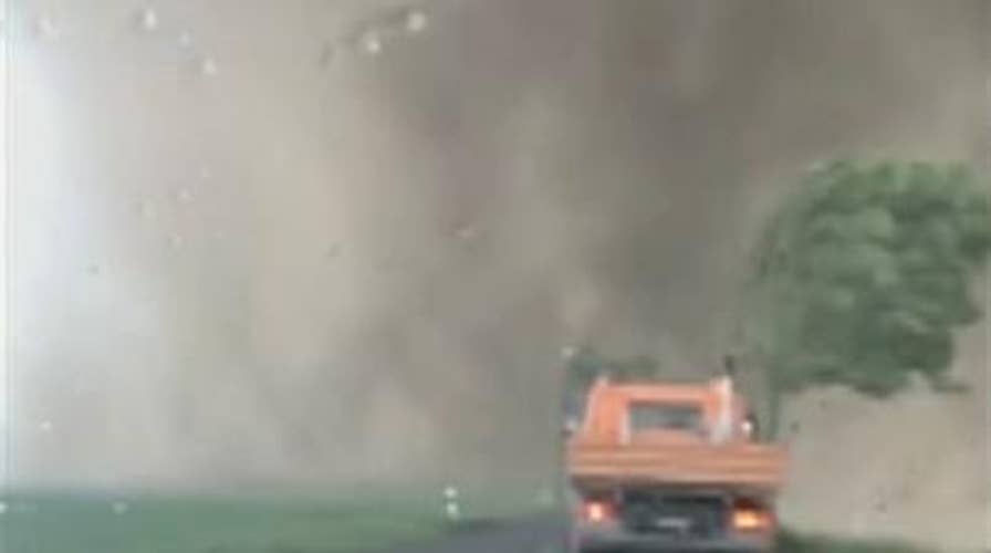 Raw video: Tornado rages past motorists in Germany