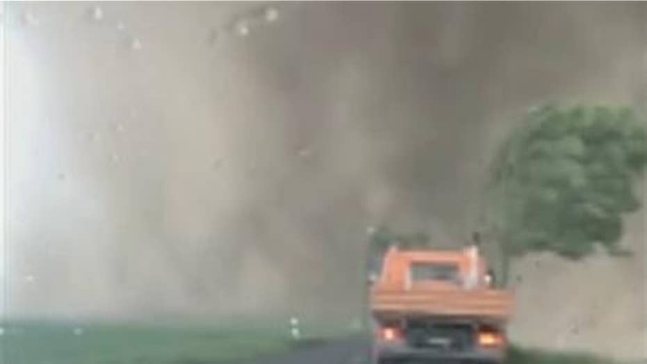 Tornado seen 'swallowing' cars with dirt, flying debris in terrifying