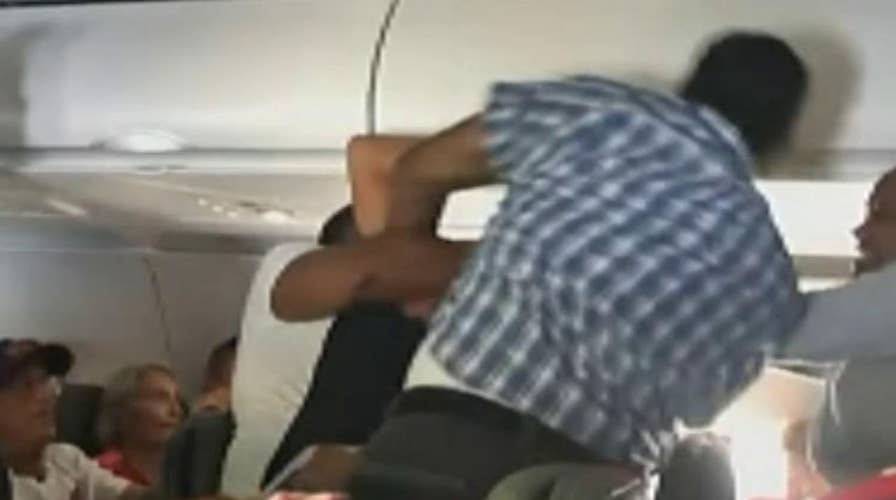 Raw video captures mid-air fight on American Airlines