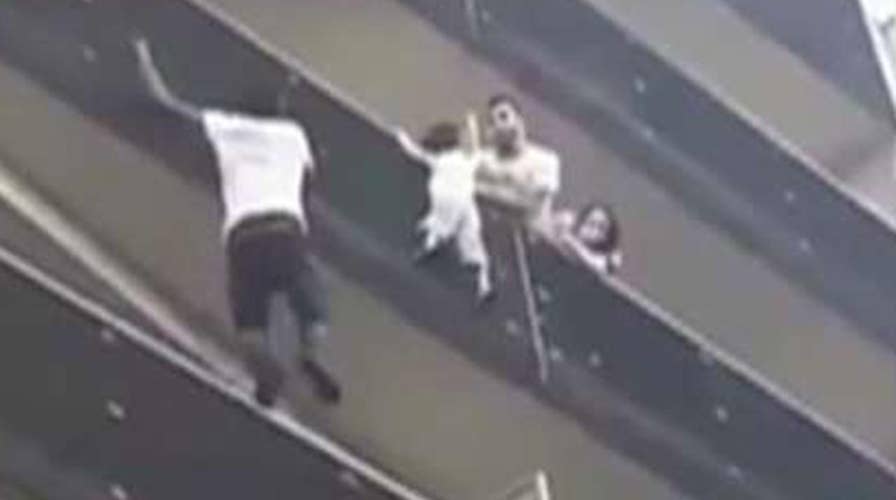 Real-life Spider-man saves toddler dangling from balcony