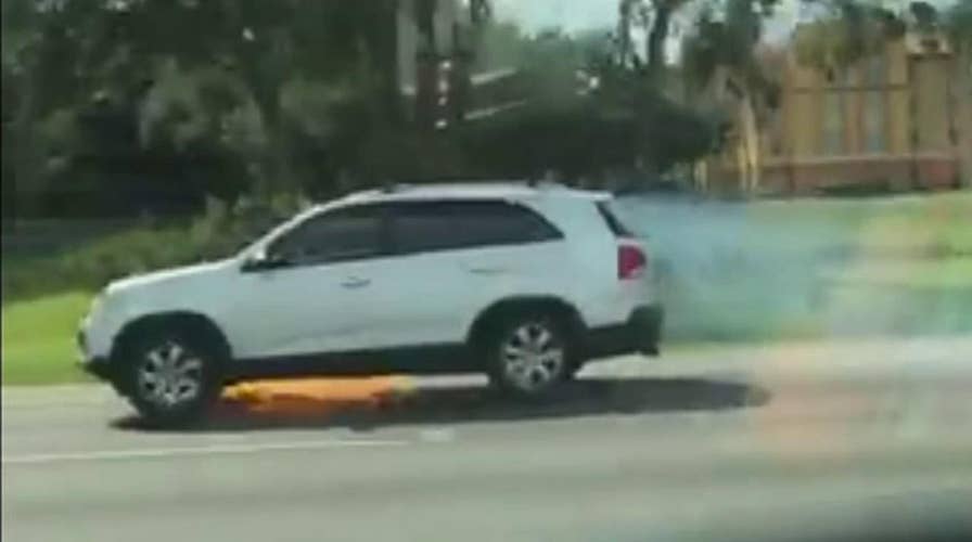 Florida woman alerts driver that SUV is on fire