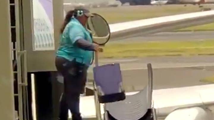 Video of baggage handler tossing suitcases sparks debate